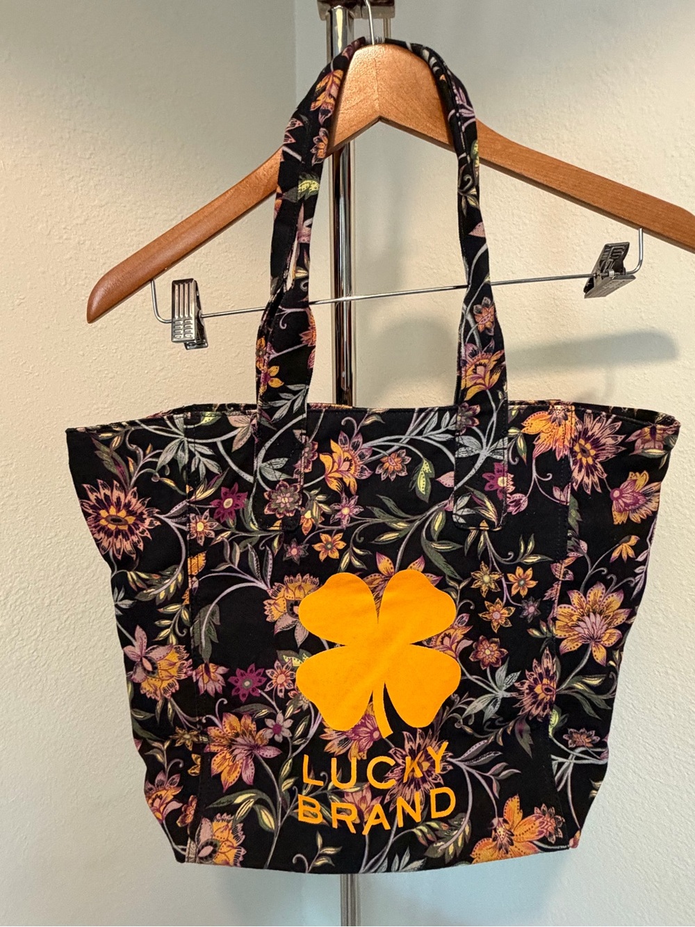 Lucky Brand Black Floral Tote with Yellow Clover Logo
